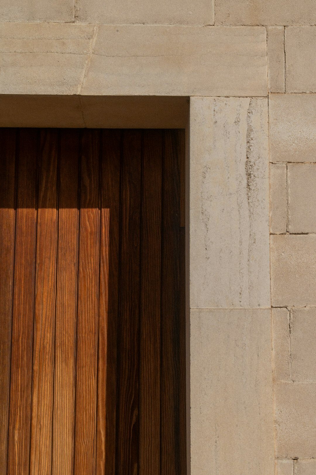 Close up of oak wood and travertine stone interior detail